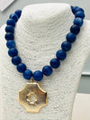 Quatrefoil Pendant on Beaded Necklace
