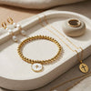 Cross Accented Shell Charm Stretch Bracelet