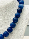 Quatrefoil Pendant on Beaded Necklace